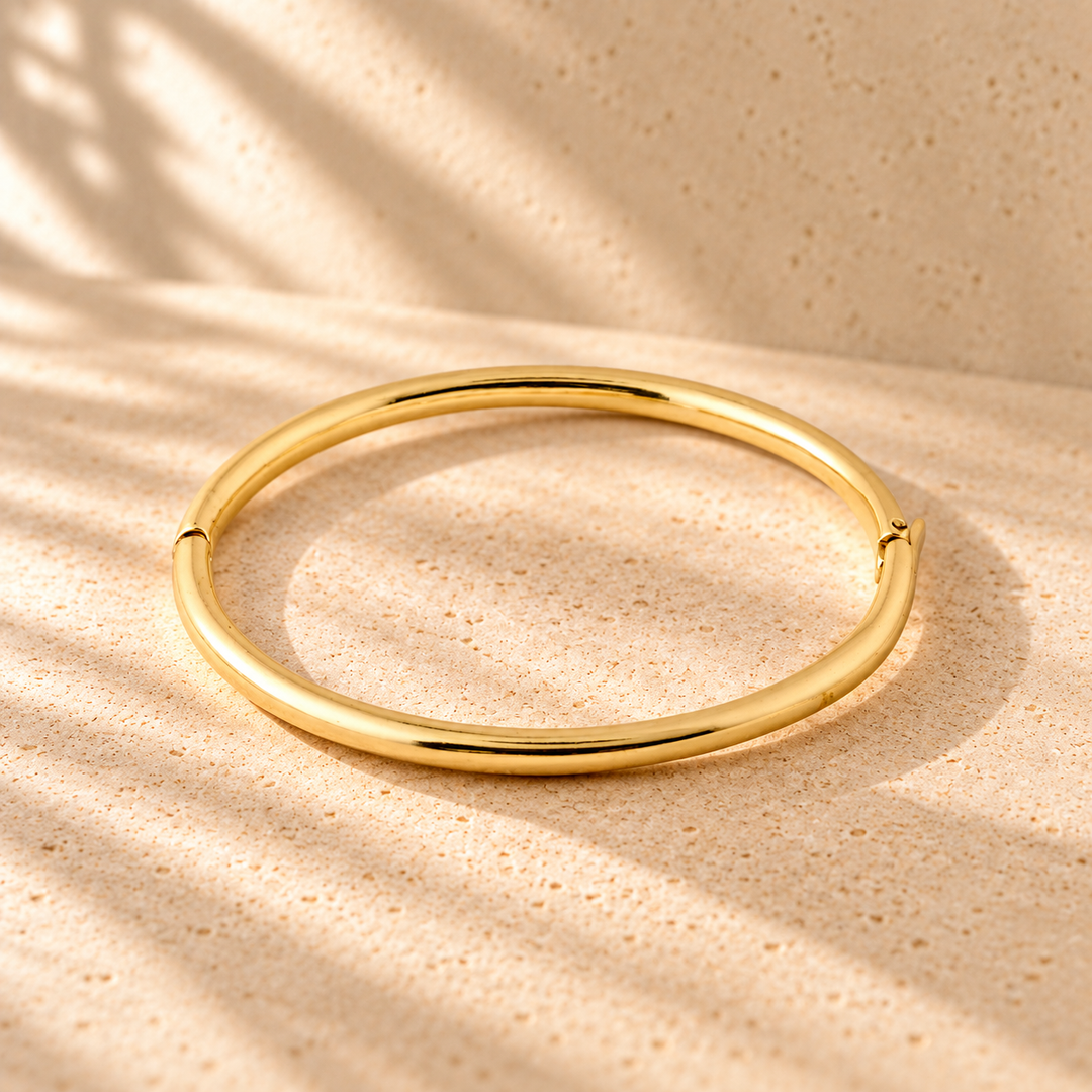 G. D’Aoust | Jewelry / Bracelets & Anklets | SOPHIA RECYCLED BANGLE BRACELET "GOLD-PLATED" on warm limestone