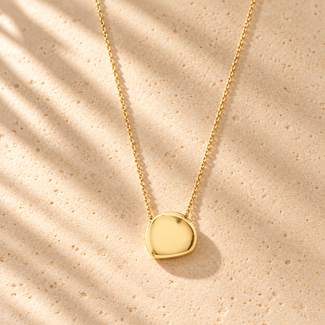 G. D’Aoust | Jewelry / Necklaces | PRESENCE COIN NECKLACE "GOLD PLATED" on warm limestone