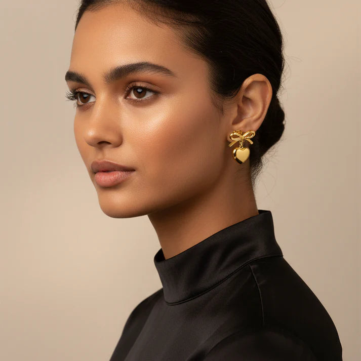 BOW &amp; HEART CHARM STUDS - GOLD